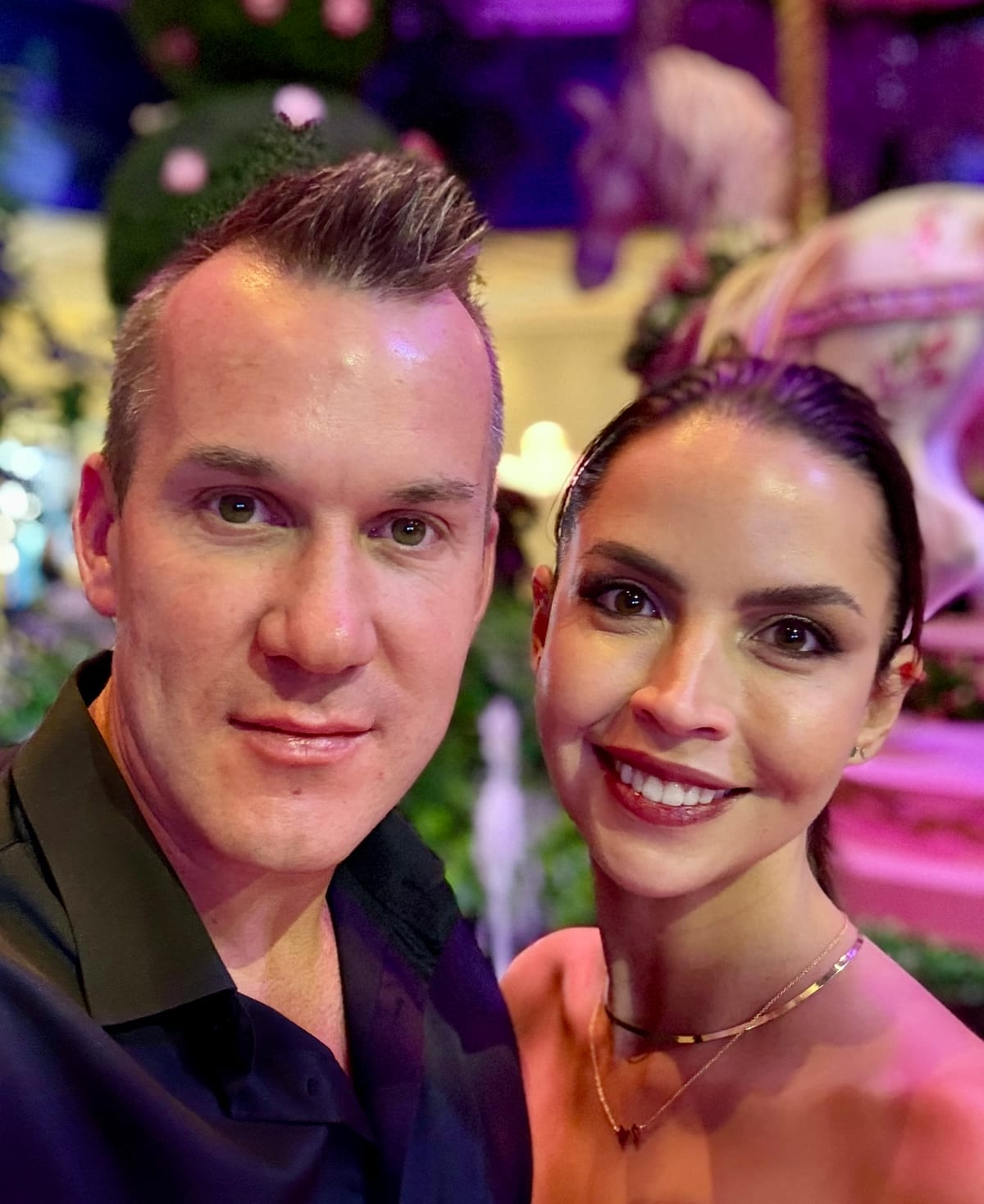 Jesse Hopps and his wife, close together, smiling at the camera